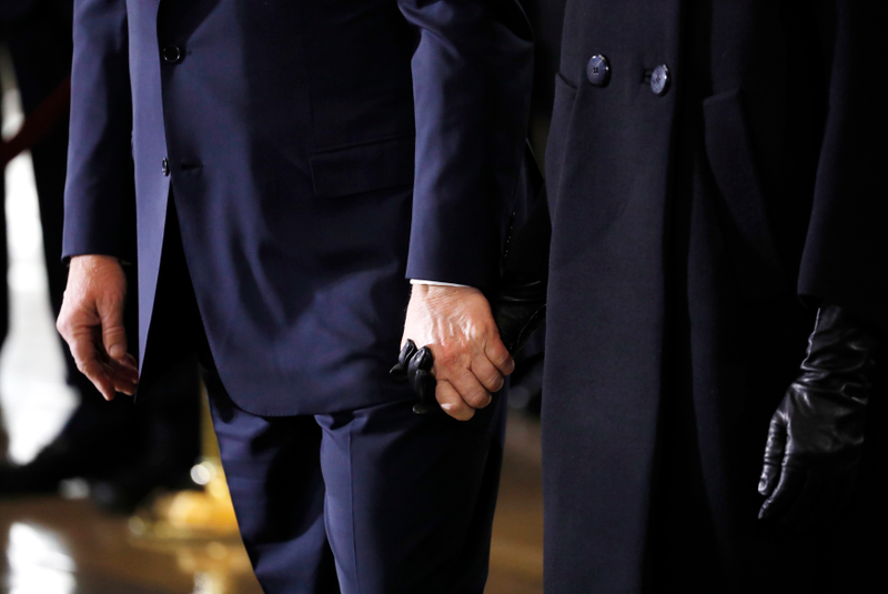 Illustration for article titled It Looks Like Donald Trump and Melania Are Holding Hands, but This Could Be a Doctored Image